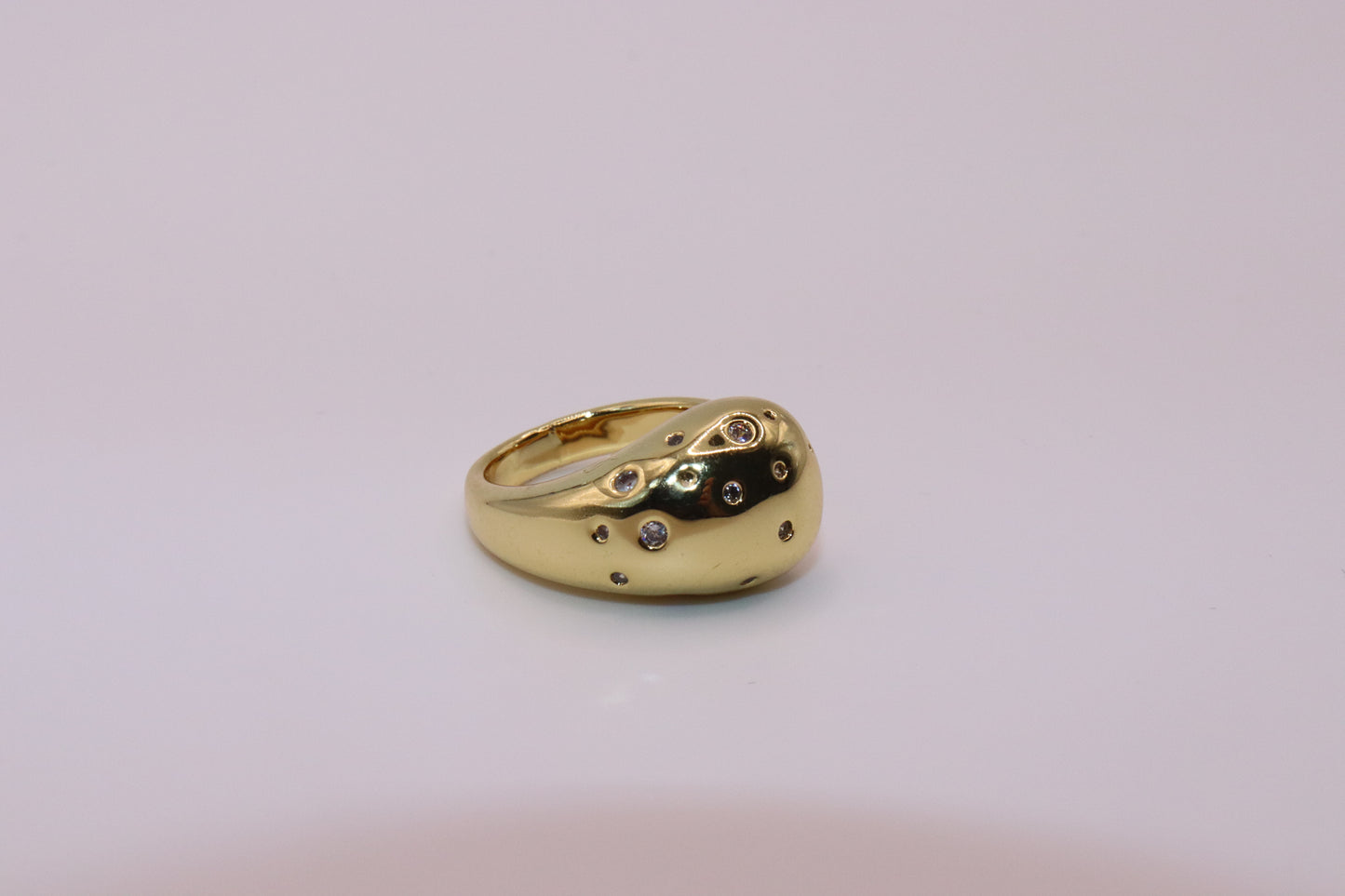 Anillo gota con circonia abierto